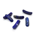 Close-up of five curved natural lapis lazuli tube beads with golden pyrite specks - Lapis Lazuli