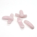 Close-up of polished pink rose quartz curved tube beads for DIY jewelry making - Rose Quartz