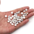White shell beads with silver owl pattern in hand for DIY necklace and bracelet crafting - 6mm / 20 Pcs/Pack / Owl