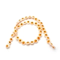 Macro view of light pink evil eye flat round shell beads for DIY jewelry making - 9mm (21g) / Orange Yellow