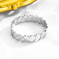 Macro detail of the silver polished stainless steel bracelet with heart leaf textures - 18K / Silver