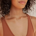 Elegant gold plated MAMA cursive letter pendant necklace for women shown on neck - MAMA Letter Necklace / 18K Gold / Steel
