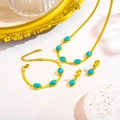 Parure de bijoux en acier titane avec chaîne dorée et pierres turquoise incluant collier - Set de turquoise bleue