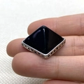 Pyramid black onyx pendant with geometric silver hollow base held by a hand - Black Agate / 28x32mm