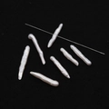 Macro shot of irregular long stick freshwater pearls with pre-drilled holes for jewelry DIY - Central Hole