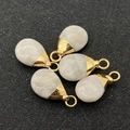 Detailed view of five teardrop pendants with white stone and golden metal caps - Cream White (No.13)