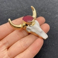 Bull head shape pendant in white with gold metal plating and red oval stone detail - US 11