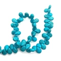 Detailed view of teardrop blue turquoise stone beads with brown matrix for DIY jewelry - Teardrop / 10x14mm