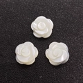 Three white mother of pearl rose flower beads with iridescent luster on black background - Style 14 (12mm)