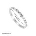 Minimalistisches dreilagiges Edelstahl-Armband mit Zahnrad-Design und 60mm Durchmesser - Stahl Zahnrad Stil