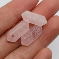 Pink rose quartz hexagonal prism pendants held in palm for DIY jewelry making - 8x20mm / Rose Quartz