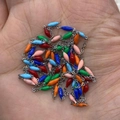 Colorful rice-shaped beads on a silver stainless steel chain held in palm for scale - 10m/Roll / Multicolor