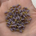 Handheld view of purple cylinder stone beads and gold metal ball chain for DIY jewelry - 3x5mm / Purple (No.2)