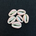 Pink glazed natural cowrie shell beads for DIY jewelry making displayed on black fabric - 13x20mm / Pink
