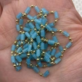 Sky blue cylindrical beads and golden metal balls on a chain held in a person's palm - 3x5mm / Cyan Blue (No. 14)