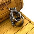 Vintage silver dragon claw pendant holding a round tiger eye stone in punk style - Tiger's Eye