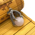 Gothic vintage silver dragon claw pendant holding a round pink crystal stone - Rose Quartz