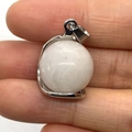 White natural stone round orb pendant with silver metal bail held in fingers - White Jade / 16x23mm