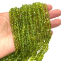 Strand of green faceted gemstone beads for DIY jewelry making and craft projects - 6mm / Peridot