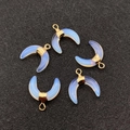 Detailed view of five crescent moon opalite pendants with gold metal caps and bail hooks - 16x16mm / Opal