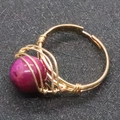 Handmade gold wire-wrapped ring featuring a large round purple gemstone in boho style - Fuchsia Gemstone (Size 10)