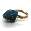 Handmade adjustable ring featuring a raw blue natural stone with golden wire wrapping - No.2 (Deep Blue)