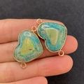 Macro detail of heart-shaped turquoise stone connector with gold plating and double loops - Blue-Green Marbled Imperial Stone Heart Style (28)