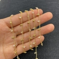 Golden DIY jewelry chain with pale pink translucent beads shown on a hand - 3.5mm / Rose Quartz Style (8)