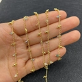 Golden delicate beaded chain necklace with faceted natural moonstone gems on palm - 3.5mm