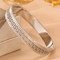 Detailed view of silver stainless steel cuff bracelet with Greek key and beaded edge - Steel