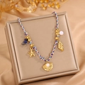 Détail du collier bohème avec étoile de mer et perles sur un coffret cadeau - Collier Corde Perle Coquillage (2)