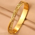 Gold plated stainless steel cross bracelet featuring classic Greek key meander pattern - Gold