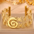 Ethnic style woven gold open bangle with layered wire design and spiral centerpiece - Open Spiral Decoration / Gold Annual Ring Pattern