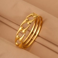 Detail view of gold hollow teardrop stainless steel bangle with polished finish - Gold