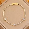 Bracelet tennis chic en acier titane doré avec zircons brillants et trois pierres rondes - Style de strass dorés