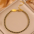 Detail of 18k gold plated beads on black woven rope bracelet with lobster clasp - Gold-Black