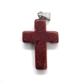 Macro shot of cross-shaped red goldstone pendant with metallic sparkles and silver bail - 18x29mm / Gold Sandstone