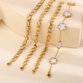 Set of four gold-tone bracelets featuring clover charm and sparkling zircon accents - White Heart Flower Five Piece Collection