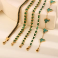 Five-piece gold bracelet set featuring heart, square, and butterfly green emerald accents - Green Butterfly Heart Five Piece Collection