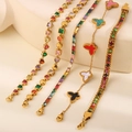 Collection of five gold-plated bracelets featuring colorful gems and butterfly motifs - Multicolor Butterfly Heart Five Piece Collection