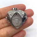 Silver angel wing heart cage pendant with a translucent white crystal ball - White Crystal