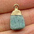 Sky blue natural stone pendant with a textured gold bail held between fingers - 15x20mm / Sky Blue Natural Stone Style (No. 4)