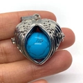 Silver angel wing heart locket pendant with blue turquoise stone inlay detail - Dark Blue Turquoise