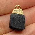 Natural black raw stone pendant with gold metal top held between fingers for size - 15x20mm / Black Raw Stone Style (Size 8)