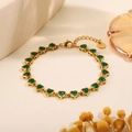 Gold stainless steel bracelet with heart-shaped green crystal settings and lobster clasp - Heart Inlaid Green Zirconia Bracelet