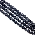 Close-up of faceted black natural stone beads in four parallel strands for DIY jewelry - 8x8x5mm (Approx 25 Pieces) / Black Agate