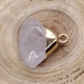 Polished fan-shaped rose quartz stone pendant with gold-plated clasp on a wood background - White Crystal