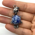 Gothic silver skull pendant holding a blue marble sodalite stone sphere bead - 20x42mm / Blue Spot Stone