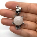 Skull pendant holding a pink gemstone sphere in a vintage silver finish - 20x42mm / White Jade