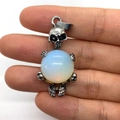 Opal stone skull pendant with silver gothic design held in hand for jewelry making - 20x42mm / Opal